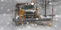 Image of plow truck in the snow