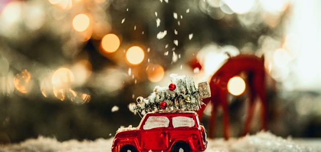 Red car ornament with a Christmas Tree on top.