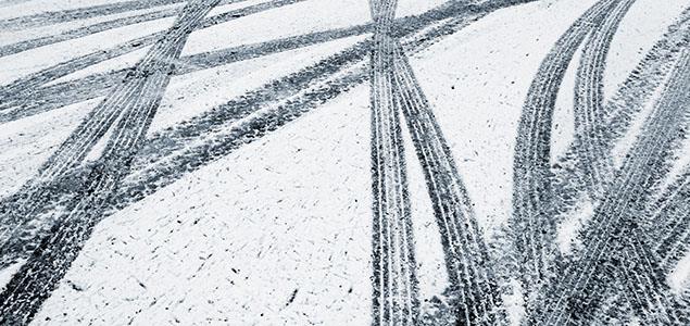 Image of tire tracks in the snow