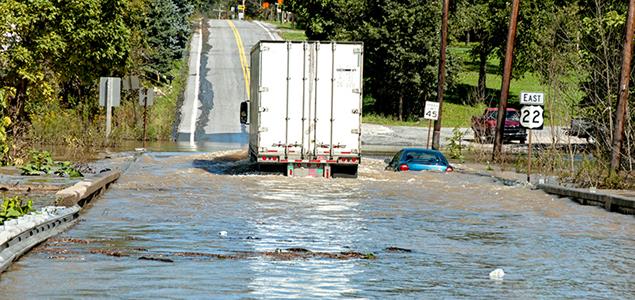 A truck and a car are submerged by flood water